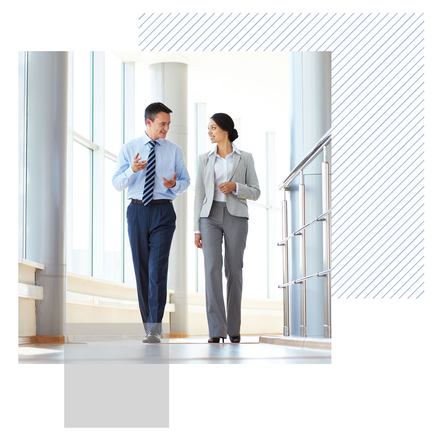 business colleagues walking down a hall in a modern office building